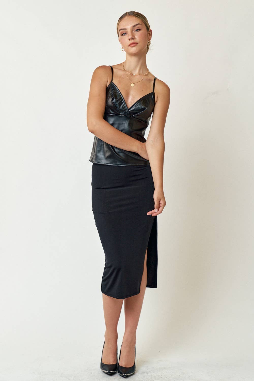 Elevate your look with Elsa’s Faux Leather Cami Top from The Flawless Closet. Sleek, stylish, and versatile, this top features a luxe faux leather finish—perfect for day-to-night style!