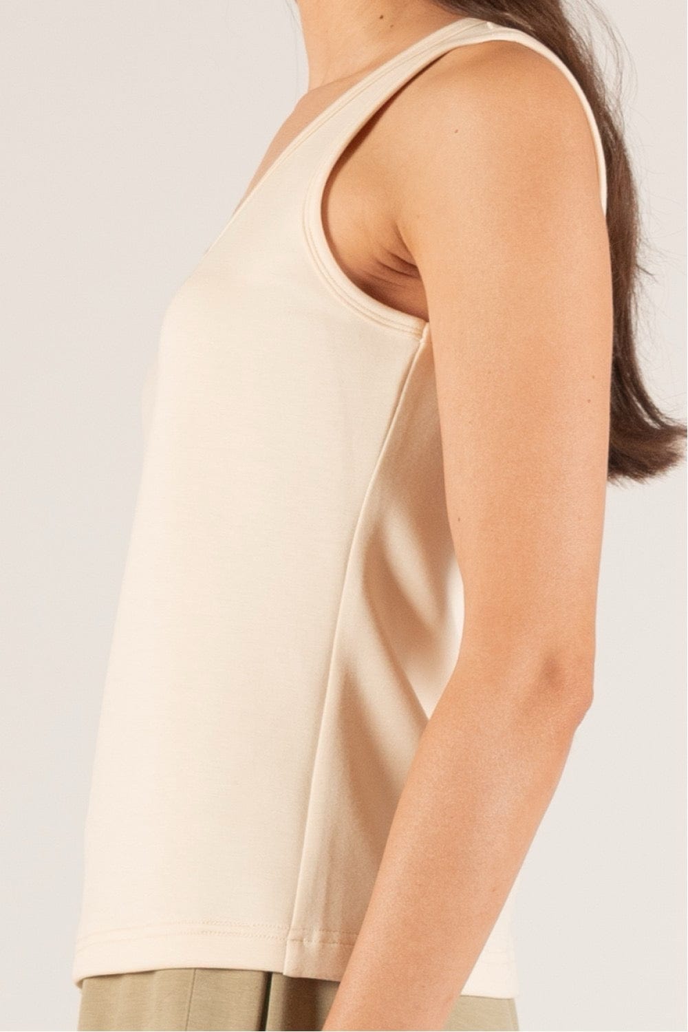 Side profile of the P Cill Butter Modal Tank, highlighting its contouring silhouette and smooth drape for effortless style.
