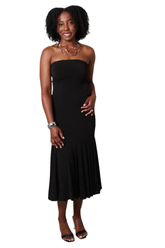 Woman wearing a black strapless dress against a plain background